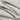 Lenzing modal double-face rib knit fabric close-up with folded drape detail and smooth dry touch for modern everyday apparel.