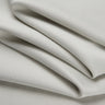 Lenzing modal double-face rib knit fabric close-up with folded drape detail and smooth dry touch for modern everyday apparel.