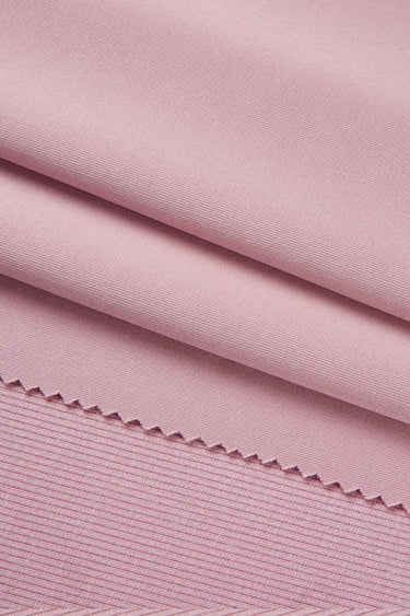 Lenzing modal double-face rib knit fabric close-up with surface fold detail and soft texture for modern apparel.