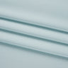 Stretch double knit base fabric close-up with surface fold detail and clean texture for modern knit garments.