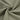 Quick-drying piqué knit fabric close-up with twist detail and subtle textured surface for polo shirts and casual tops.