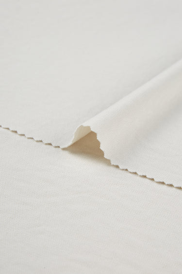 Sand-washed Lenzing modal stretch double knit fabric close-up with backing detail and refined texture for sweatshirts and everyday garments.