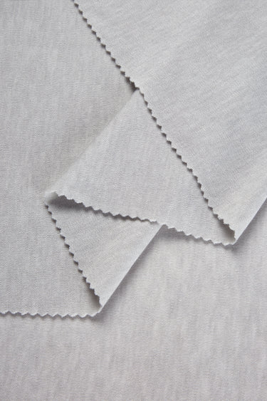 TENCEL wool blend interlock fabric close-up with layered fold detail for soft knit garments and everyday wear.