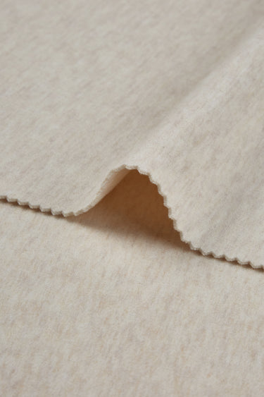 HEAT-FLOW fleece knit fabric close-up with backing detail for warm hoodies and thermal tops.