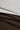 Mousse rib knit fabric close-up with layered edge detail for modern casualwear and knit garments.