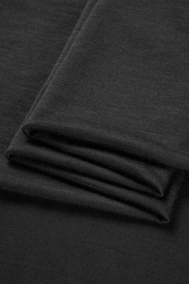 TENCEL wool blend single jersey fabric close-up with folded stack detail and smooth hand feel for lightweight base layers.