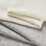 Mousse rib knit fabric close-up with layered fold detail for modern casualwear and comfortable knit garments.