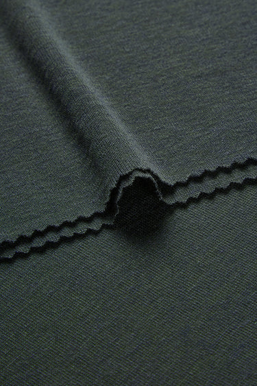 TENCEL wool blend stretch rib knit fabric close-up with edge structure detail and soft texture for comfortable knit garments.