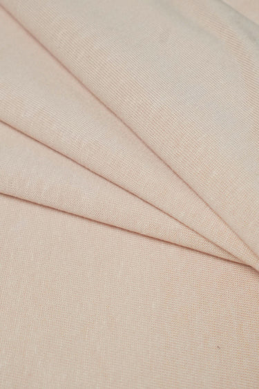 TENCEL linen blend stretch rib knit fabric close-up with diagonal fold detail for resort garments and relaxed everyday pieces.