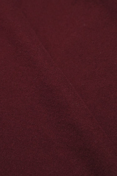 Wool blend mousse knit fabric close-up with smooth surface texture for modern casualwear and knit garments.