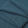 Bamboo slub mousse knit fabric close-up with folded detail and natural surface texture for modern casualwear.