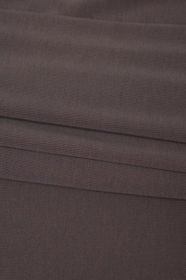Sand-washed rib knit fabric close-up with refined surface texture and soft hand feel for sweatshirts and knitwear.