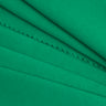 TENCEL linen blend single jersey fabric close-up with folded detail and natural dry texture for lightweight tops and summer knitwear.